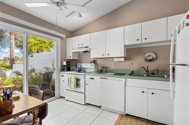 805 Waterside Ln, Bradenton, FL 34209 - kitchen with white appliances, under cabinet range hood, vaulted ceiling, light tile patterned flooring, and a ceiling fan