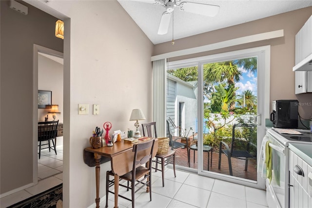 805 Waterside Ln, Bradenton, FL 34209 - kitchen with white electric stove, ceiling fan, white cabinets, and light tile patterned flooring