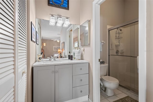 805 Waterside Ln, Bradenton, FL 34209 - bathroom with vanity, a stall shower, tile patterned floors, and a ceiling fan