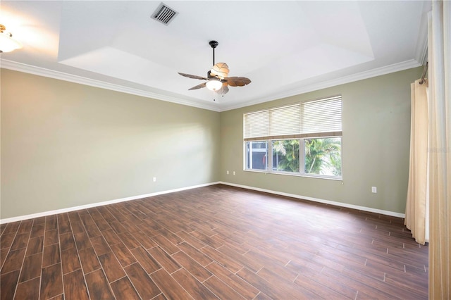 1801 Highland Rd, Osprey, FL 34229 - empty room with a tray ceiling, a ceiling fan, dark wood finished floors, and ornamental molding