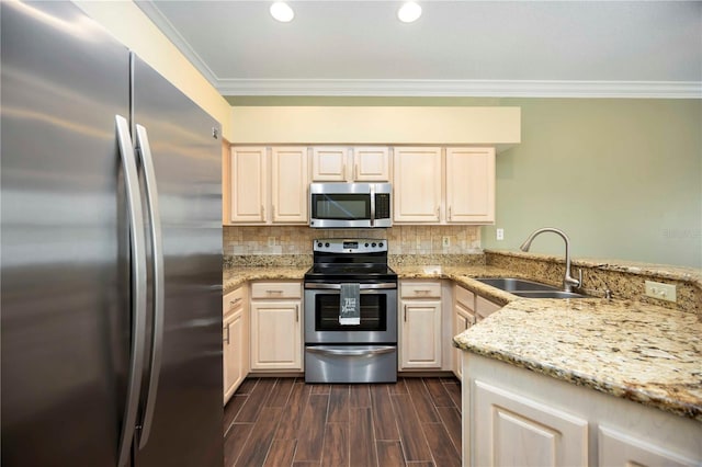 1801 Highland Rd, Osprey, FL 34229 - kitchen with appliances with stainless steel finishes, crown molding, light stone counters, backsplash, and a peninsula
