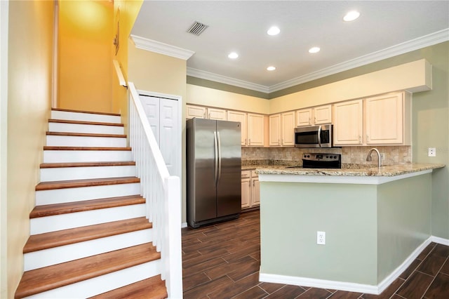 1801 Highland Rd, Osprey, FL 34229 - kitchen featuring stainless steel appliances, ornamental molding, wood tiled floors, backsplash, and recessed lighting