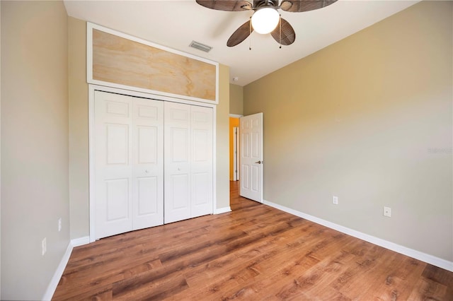 1801 Highland Rd, Osprey, FL 34229 - unfurnished bedroom with wood finished floors, a closet, and a ceiling fan