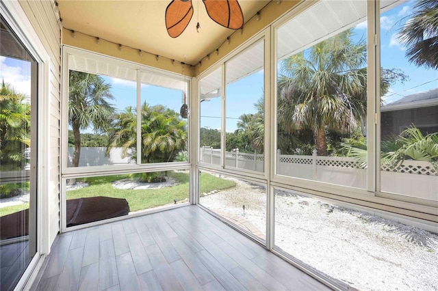 1801 Highland Rd, Osprey, FL 34229 - unfurnished sunroom featuring ceiling fan and a water view