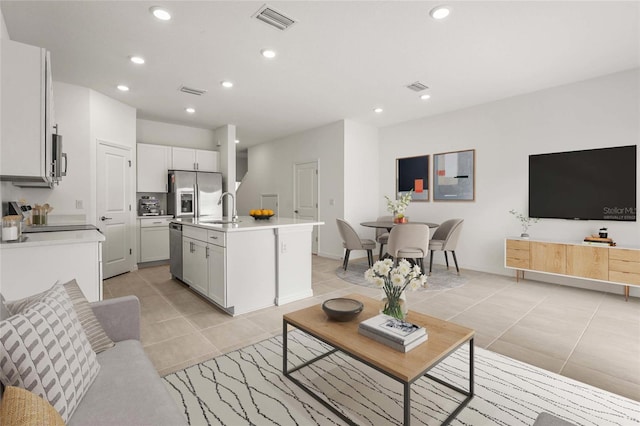 8705 Winter Breeze Way, Sarasota, FL 34241 - living room featuring light tile patterned flooring and recessed lighting