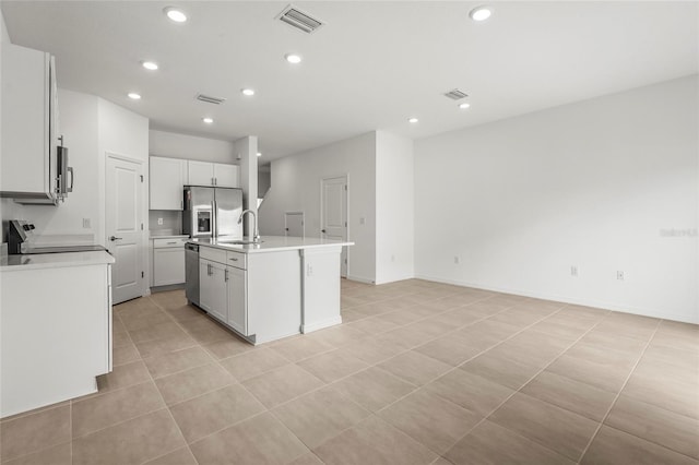 8705 Winter Breeze Way, Sarasota, FL 34241 - kitchen featuring appliances with stainless steel finishes, recessed lighting, light countertops, a kitchen island with sink, and open floor plan