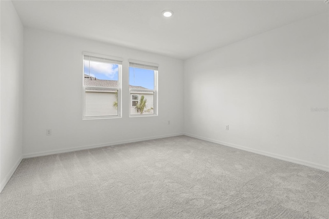 8705 Winter Breeze Way, Sarasota, FL 34241 - spare room with light colored carpet and recessed lighting