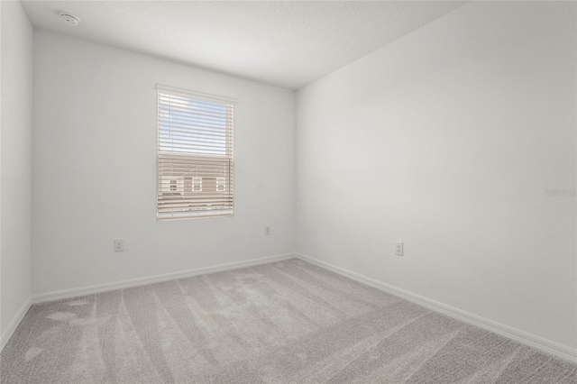 8705 Winter Breeze Way, Sarasota, FL 34241 - empty room featuring carpet flooring and a smoke detector