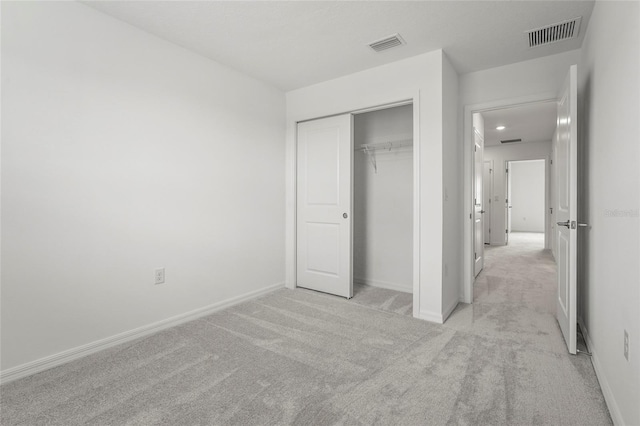 8705 Winter Breeze Way, Sarasota, FL 34241 - unfurnished bedroom featuring light carpet, a closet, and recessed lighting