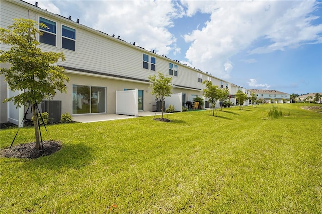 8705 Winter Breeze Way, Sarasota, FL 34241 - back of house featuring a patio area, a yard, and a residential view