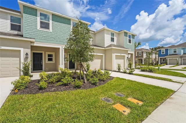 8705 Winter Breeze Way, Sarasota, FL 34241 - multi unit property featuring driveway, a garage, a front yard, and a residential view
