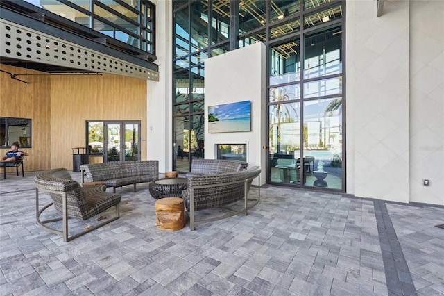 8705 Winter Breeze Way, Sarasota, FL 34241 - view of patio with an outdoor living space with a fireplace