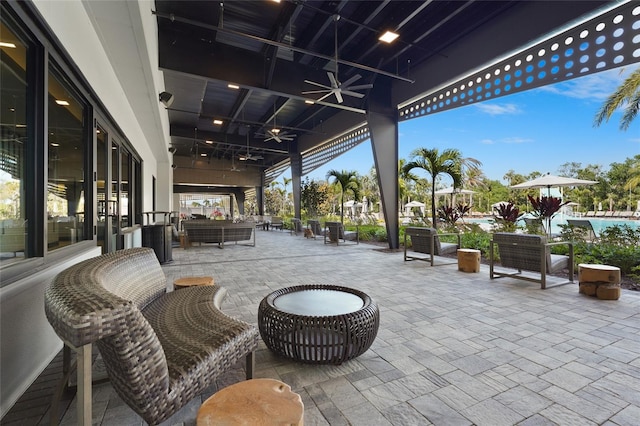 8705 Winter Breeze Way, Sarasota, FL 34241 - view of patio featuring ceiling fan, an outdoor pool, and an outdoor living space