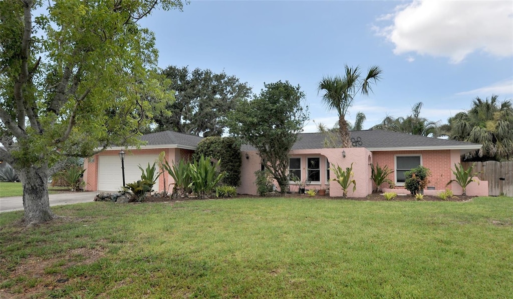 1308 63rd St NW, Bradenton, FL 34209 - ranch-style home with driveway, a garage, and brick siding