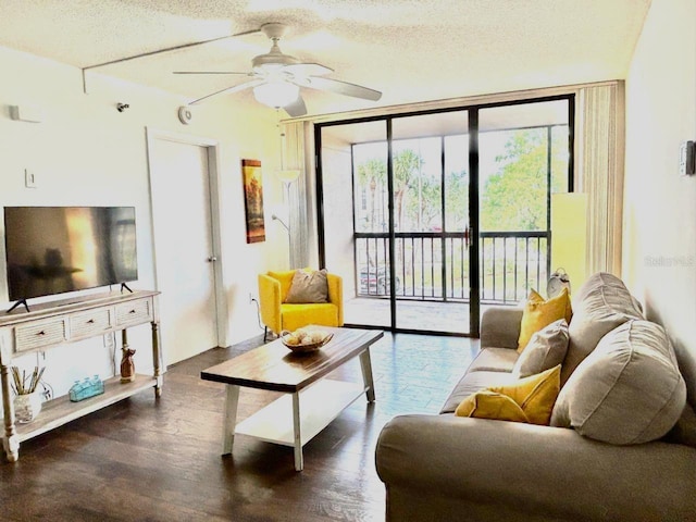 21405 Olean Blvd Unit 224, Port Charlotte, FL 33952 - living room featuring ceiling fan, a textured ceiling, and wood finished floors