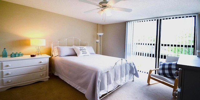 21405 Olean Blvd Unit 224, Port Charlotte, FL 33952 - carpeted bedroom featuring access to outside, a ceiling fan, and a textured ceiling