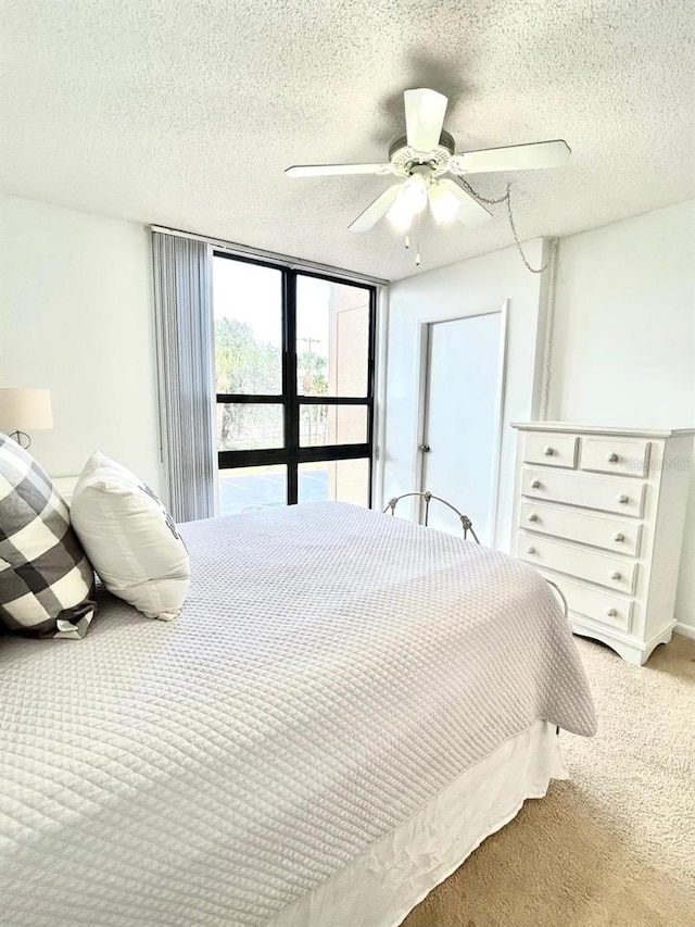 21405 Olean Blvd Unit 224, Port Charlotte, FL 33952 - carpeted bedroom with ceiling fan and a textured ceiling