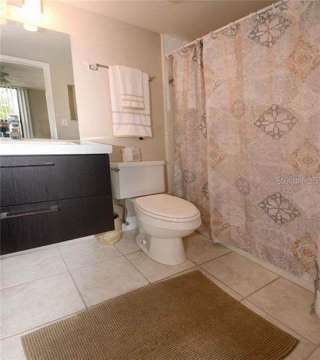 21405 Olean Blvd Unit 224, Port Charlotte, FL 33952 - bathroom with vanity, tile patterned flooring, a ceiling fan, and curtained shower