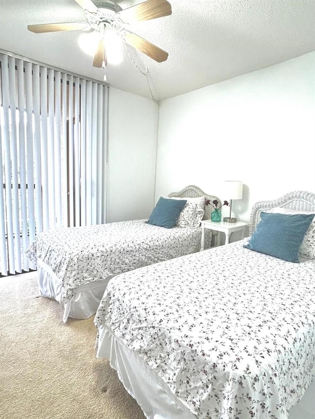 21405 Olean Blvd Unit 224, Port Charlotte, FL 33952 - carpeted bedroom with ceiling fan and a textured ceiling