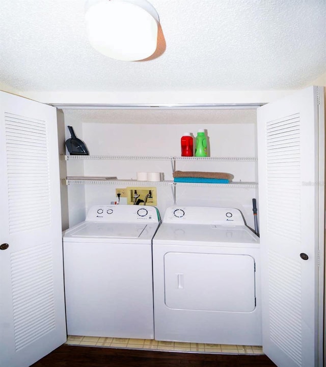 21405 Olean Blvd Unit 224, Port Charlotte, FL 33952 - washroom with independent washer and dryer and a textured ceiling