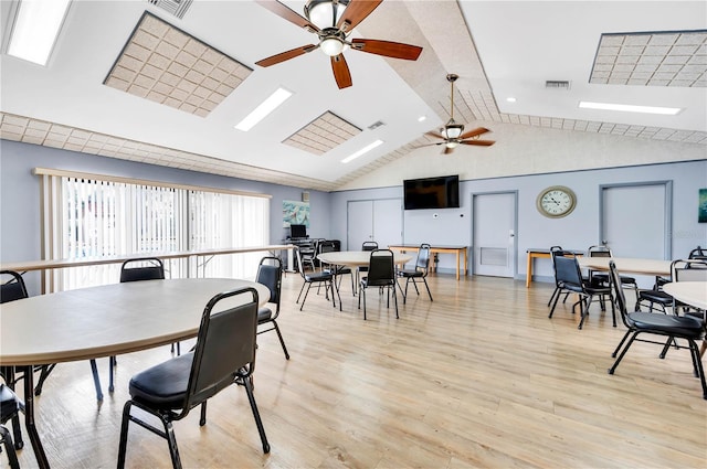 21405 Olean Blvd Unit 224, Port Charlotte, FL 33952 - dining room featuring ceiling fan, lofted ceiling, and light wood finished floors