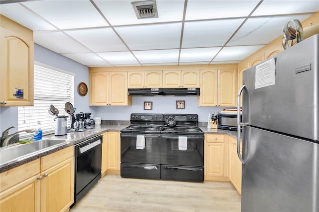 21405 Olean Blvd Unit 224, Port Charlotte, FL 33952 - kitchen with black appliances, under cabinet range hood, light brown cabinets, a paneled ceiling, and light wood-type flooring