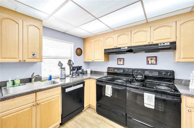 21405 Olean Blvd Unit 224, Port Charlotte, FL 33952 - kitchen featuring light brown cabinetry, black appliances, under cabinet range hood, dark countertops, and light wood-style flooring