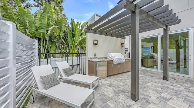 2590 Floyd St, Sarasota, FL 34239 - view of patio with a pergola and an outdoor kitchen