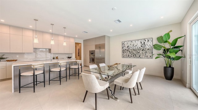 2590 Floyd St, Sarasota, FL 34239 - dining area with light tile patterned floors and recessed lighting