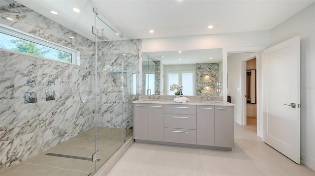 2590 Floyd St, Sarasota, FL 34239 - bathroom with a marble finish shower, double vanity, recessed lighting, and tile patterned flooring