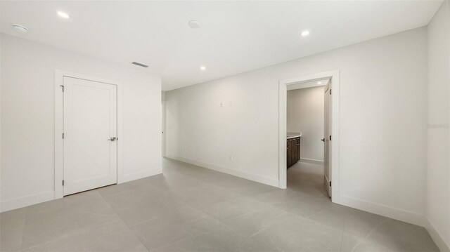 2590 Floyd St, Sarasota, FL 34239 - spare room featuring recessed lighting, a smoke detector, and light tile patterned floors