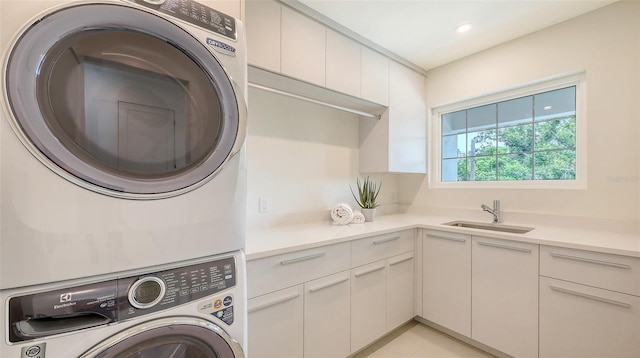 2590 Floyd St, Sarasota, FL 34239 - laundry room featuring stacked washer / dryer, cabinet space, and recessed lighting