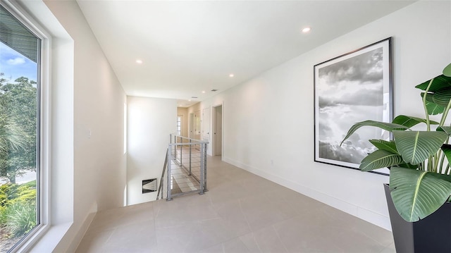 2590 Floyd St, Sarasota, FL 34239 - corridor with an upstairs landing, healthy amount of natural light, recessed lighting, and tile patterned floors