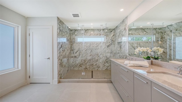 2590 Floyd St, Sarasota, FL 34239 - bathroom featuring a marble finish shower, double vanity, and tile patterned flooring