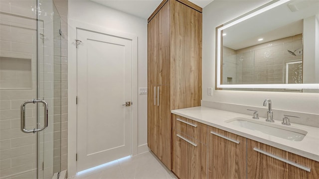 2590 Floyd St, Sarasota, FL 34239 - bathroom with vanity, a shower stall, tile patterned floors, and recessed lighting