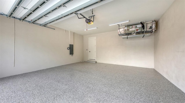 2590 Floyd St, Sarasota, FL 34239 - garage featuring a garage door opener and electric panel