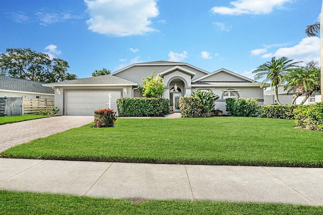 5206 19th Ave W, Bradenton, FL 34209 - single story home featuring decorative driveway, stucco siding, and an attached garage