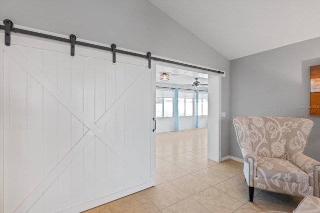 5206 19th Ave W, Bradenton, FL 34209 - living area with a barn door, lofted ceiling, and light tile patterned floors