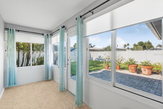 5206 19th Ave W, Bradenton, FL 34209 - unfurnished sunroom with plenty of natural light and tile patterned floors