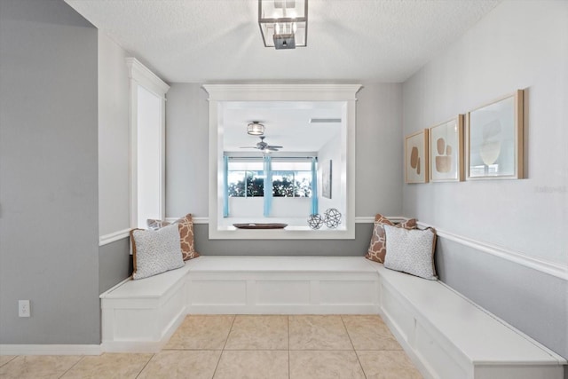5206 19th Ave W, Bradenton, FL 34209 - mudroom with a textured ceiling, light tile patterned floors, and a ceiling fan