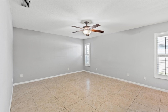 5206 19th Ave W, Bradenton, FL 34209 - empty room with ceiling fan, plenty of natural light, and light tile patterned floors