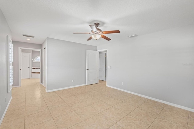 5206 19th Ave W, Bradenton, FL 34209 - unfurnished room with ceiling fan and light tile patterned flooring