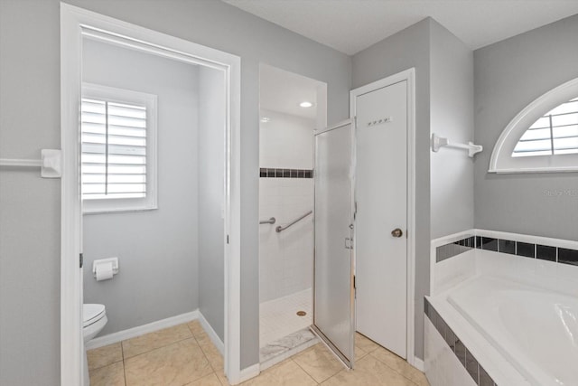5206 19th Ave W, Bradenton, FL 34209 - full bathroom featuring a garden tub, a shower stall, and tile patterned floors