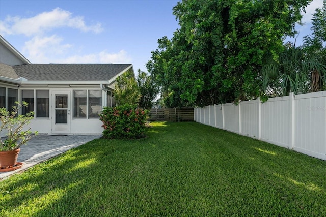 5206 19th Ave W, Bradenton, FL 34209 - fenced backyard with a sunroom