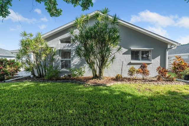 5206 19th Ave W, Bradenton, FL 34209 - view of property exterior with stucco siding and a lawn