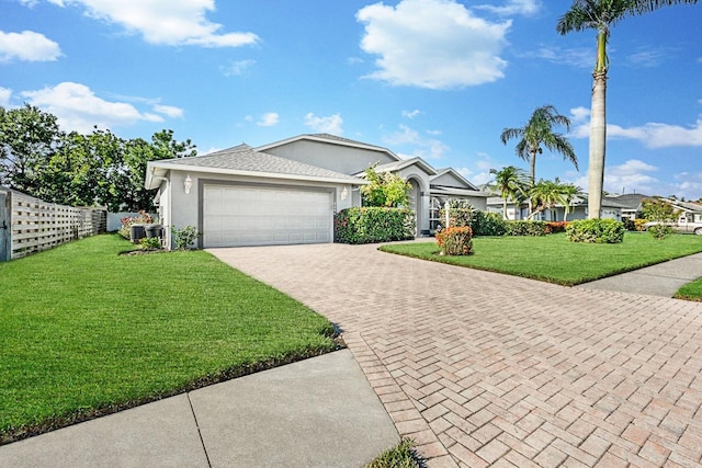 5206 19th Ave W, Bradenton, FL 34209 - ranch-style house featuring driveway, a garage, and stucco siding