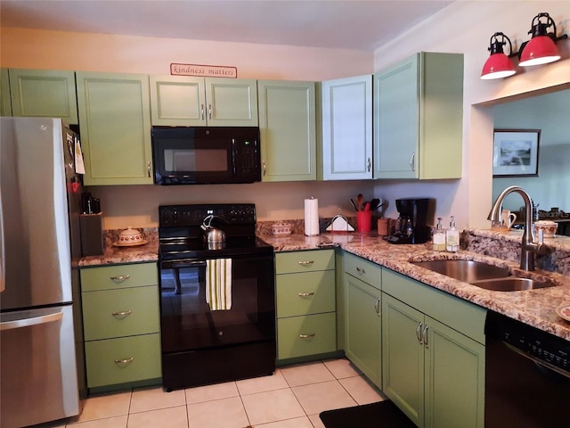 137 Pineneedle Dr Unit 137, Bradenton, FL 34210 - kitchen with black appliances, light tile patterned flooring, and green cabinetry