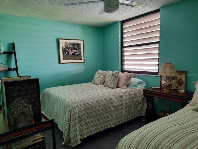 137 Pineneedle Dr Unit 137, Bradenton, FL 34210 - carpeted bedroom featuring a textured ceiling and a ceiling fan