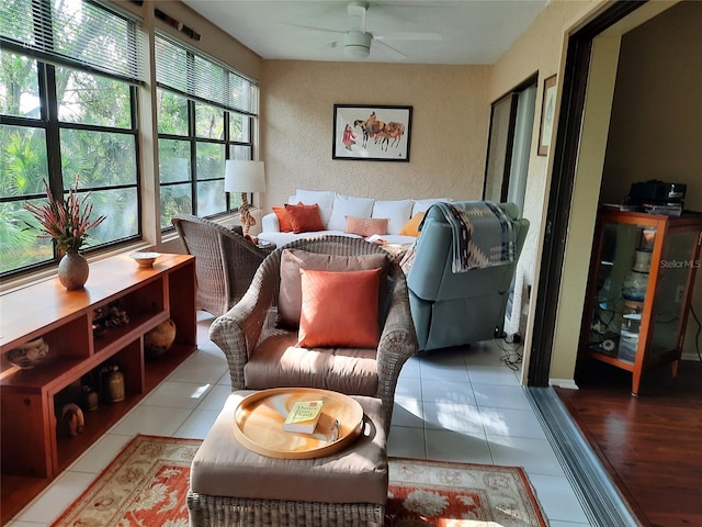 137 Pineneedle Dr Unit 137, Bradenton, FL 34210 - tiled living area featuring a ceiling fan and a textured wall