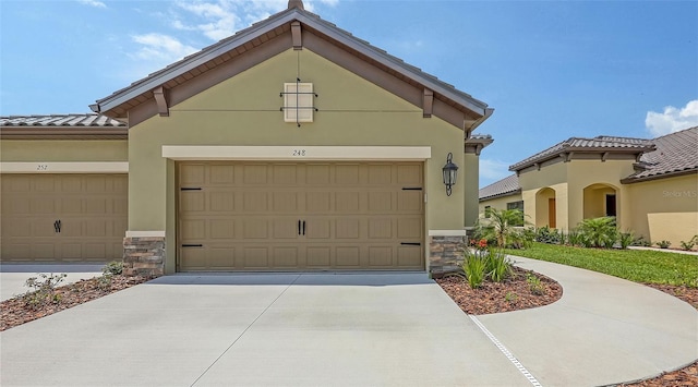 248 Altamura Cir, Nokomis, FL 34275 - view of front of house with stone siding, stucco siding, and concrete driveway